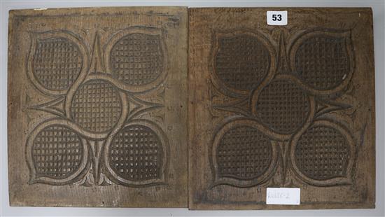 A pair of carved wood panels, 31 x 28.5cm.